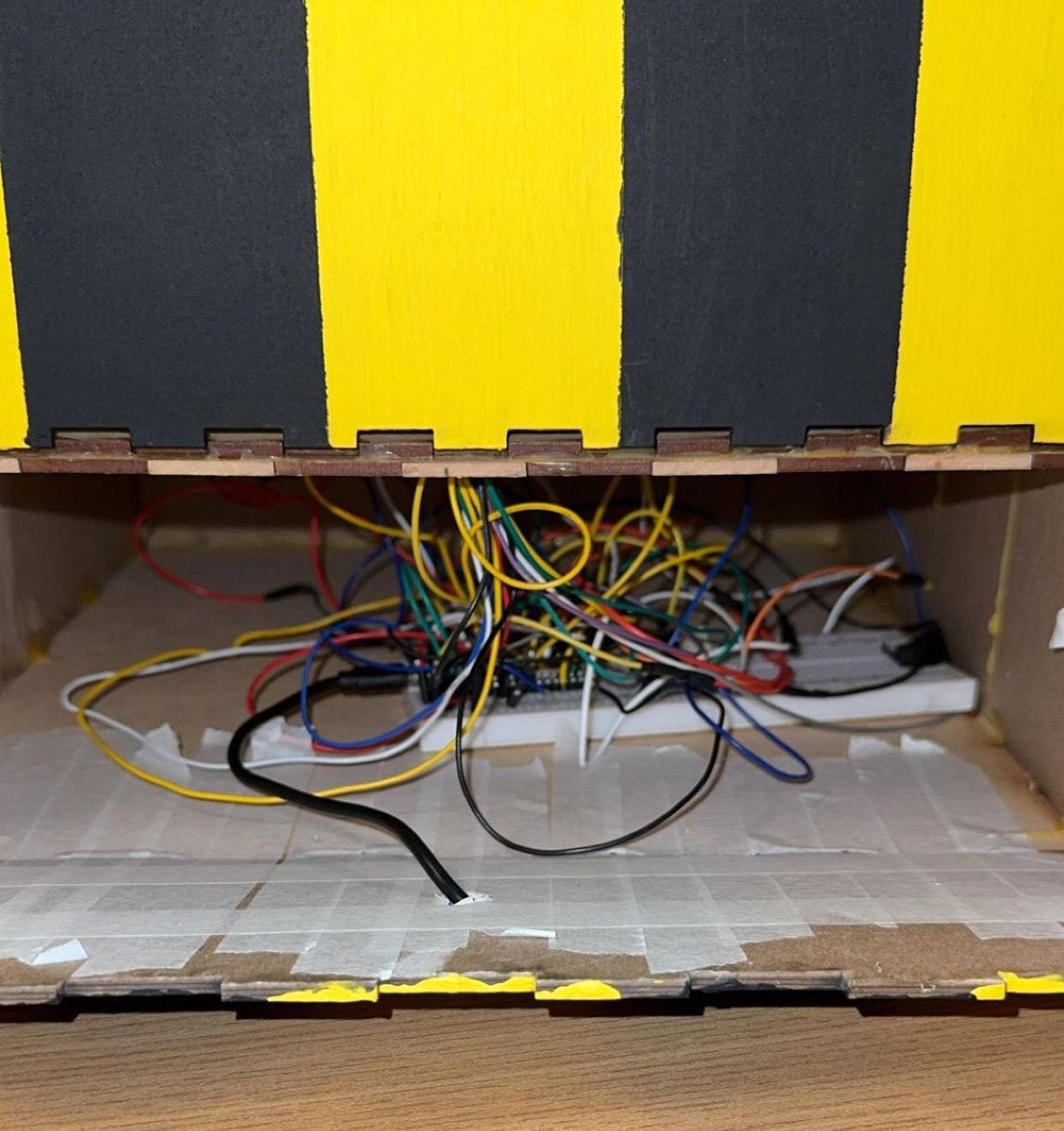 Wiring inside the laser-cut enclosure, seen from the front